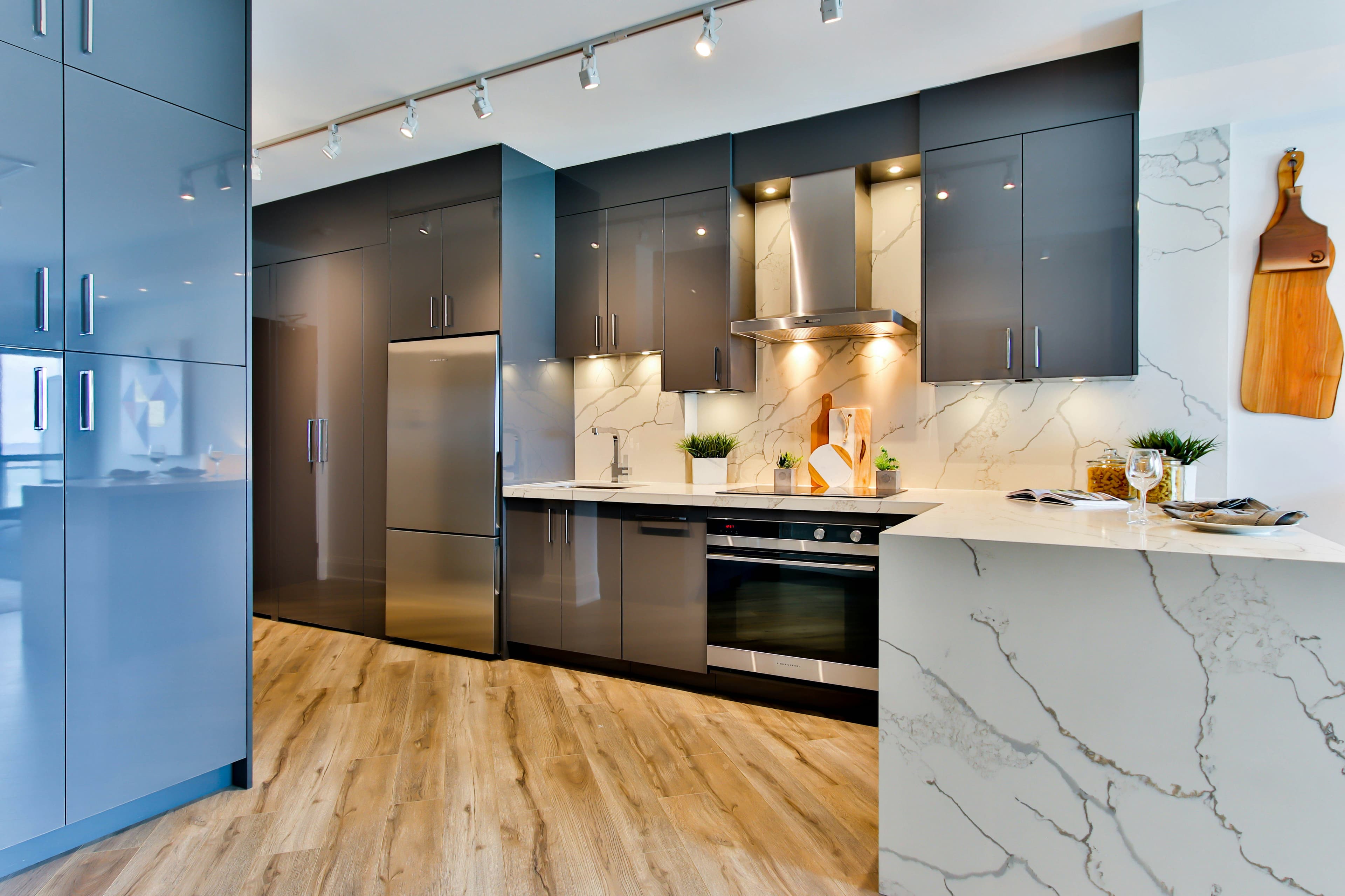 Picture of a luxury remodeled kitchen with granite countertops stainless steel hardware and sinks and new stainless steel fixtures